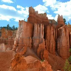 Bright skies and crimson colored rock spires.