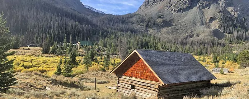 Red cabin in mountains