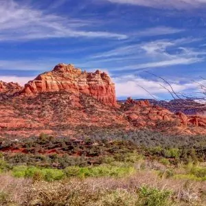 Beautiful sandstone rock formations line the blue sky