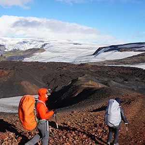 Hikers on path with glaciers