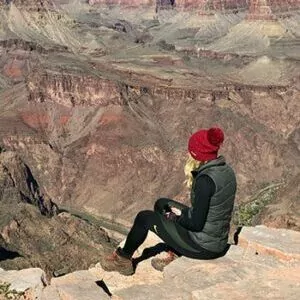 Grand Canyon in October hiker cliff overlook woman guided tour